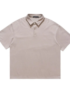 Khaki cotton polo shirt with buttoned collar and short sleeves.