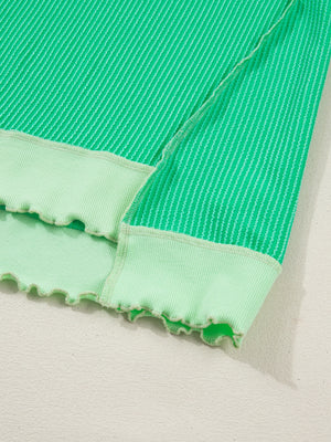 Twist ribbed t-shirt in bright green with contrast stitching and lettuce hem detail.