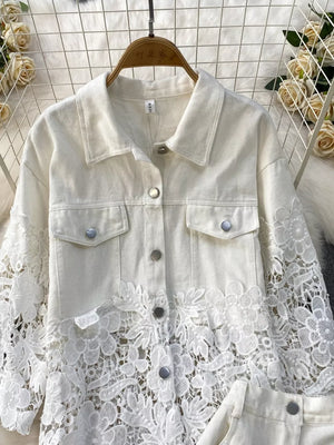 White two-piece set with lace embellishments on sleeves and hem, collared button-up jacket.