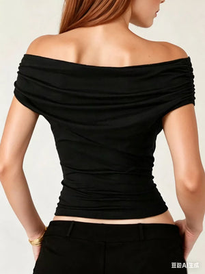 Black off-shoulder ruched t-shirt with short sleeves and a draped neckline.
