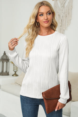 Textured white crewneck pullover with long sleeves and a wave pattern.