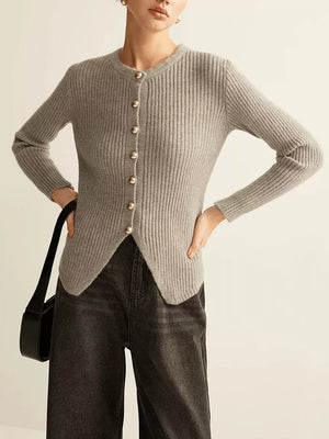 Grey ribbed knit cardigan with crew neck, gold buttons, and asymmetrical hem.
