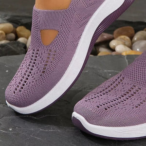 Purple breathable mesh slip-on shoes with white soles and cut-out detail.