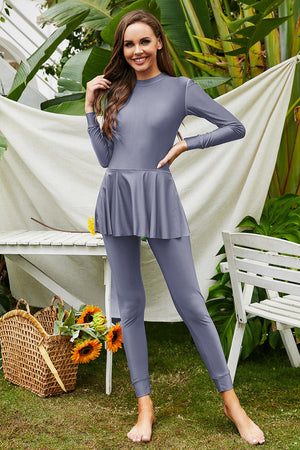 Dark Gray long sleeve swimsuit with flounce hem and leggings.