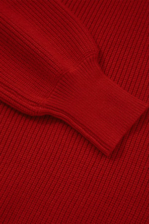 Red ribbed knit sweater with a backless bow detail