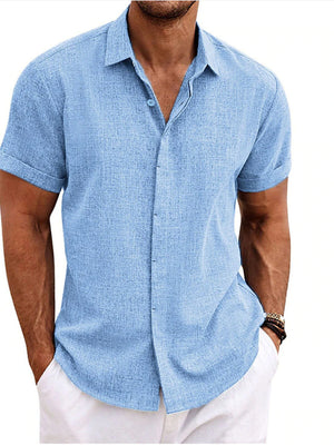 Men's light blue short sleeve button-down shirt, casual cotton blend, classic collar.
