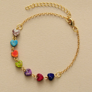 Multicolor heart stone bracelet with gold chain and clasp.
