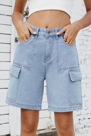 Medium wash denim utility shorts with large cargo pockets and contrast stitching.