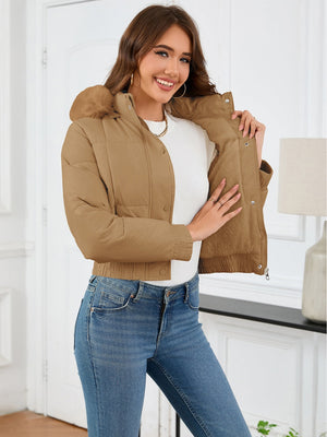 Camel puffer jacket with faux fur trim and elastic cuffs.