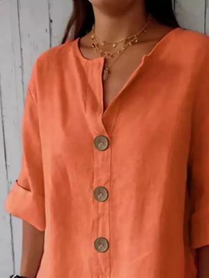 Orange button-down shirt with relaxed fit and wooden buttons