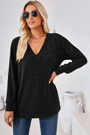 Black relaxed V-neck tunic top with long sleeves and a heathered texture.
