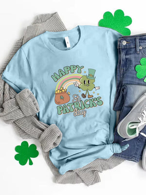 Light blue St. Patrick's Day graphic t-shirt with a cartoon clover, rainbow, and pot of gold.