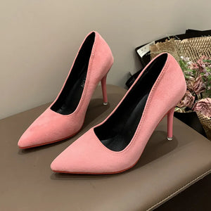 Pink suede pointed stiletto pumps with crimson soles