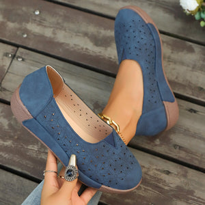 Blue floral cutout slip-on loafers with breathable design.