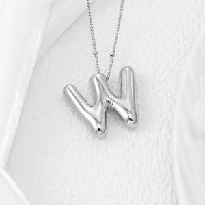 Silver letter pendant necklace with bubble font on a delicate chain