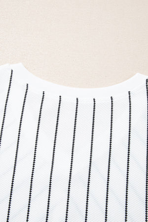 White relaxed fit blouse with black vertical pinstripes and a textured fabric.