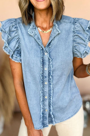 Light blue denim button-up shirt with frayed ruffle trim on sleeves and placket.