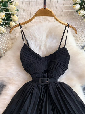 Black belted midi dress with spaghetti straps and pleated details.