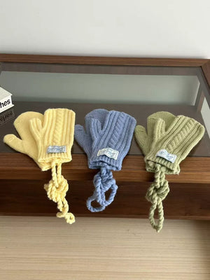 Yellow, blue, and green cable knit acrylic gloves with braided rope detail.
