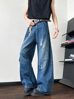 Distressed dark blue oversized wide-leg jeans with ankle length and a casual fit.