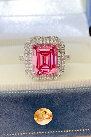 Hot pink emerald cut halo ring with pave diamond band