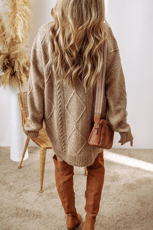 Tan cable knit sweater dress with diamond pattern, crew neck, and long sleeves.