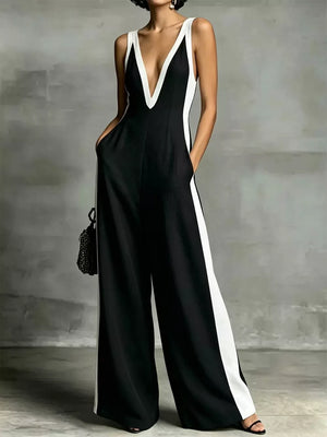 Black wide-leg jumpsuit with white contrast trim and deep V-neck