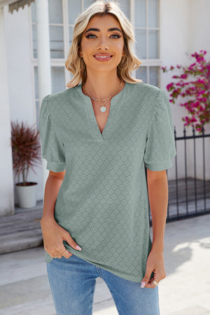 Light Green eyelet V-neck blouse with puff sleeves and a textured pattern.