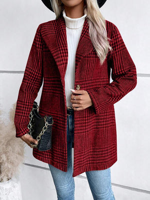 Crimson plaid single-button tailored overcoat with a notched lapel, worn open over a white turtleneck.