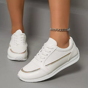 White lace-up sneakers with iridescent trim and perforated detail.