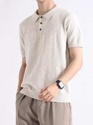 Beige textured cotton blend short-sleeve polo with button detail and classic collar.