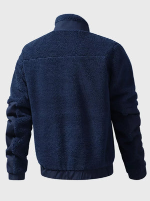 Dark blue sherpa fleece zip-up jacket with contrasting nylon sleeves and collar.