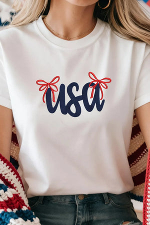 White cotton t-shirt with navy USA embroidery and red bow details