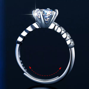 Radiant moissanite silver ring with a solitaire diamond and accent stones on the band.