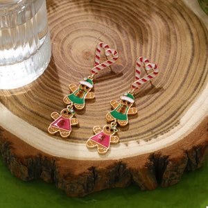 Festive dangle earrings with gingerbread men and candy cane hearts.