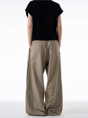 Men's khaki relaxed fit sweatpants with elastic waistband shown from back