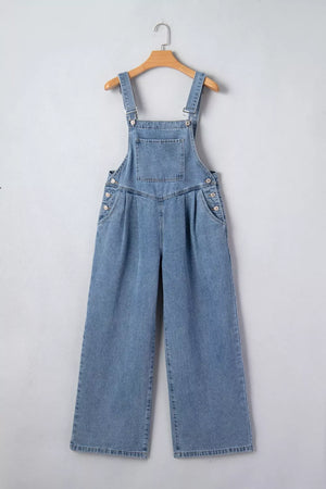 Light wash denim wide-leg jumpsuit with button details and pleated front.