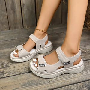Beige platform sandals with contrast stitching and adjustable straps.