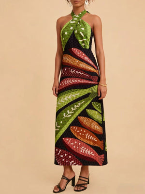Tropical print halter neck midi dress with fish and leaf pattern.