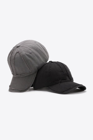 Raw edge denim baseball caps in mid gray and black with distressed details