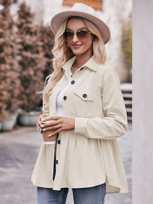 Beige corduroy peplum shirt jacket with buttoned front and chest pockets.