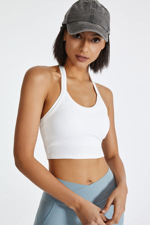 White ribbed halter crop top with a racerback detail.