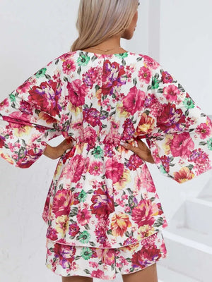Floral ruffle hem mini dress with wide sleeves and a cinched waist.
