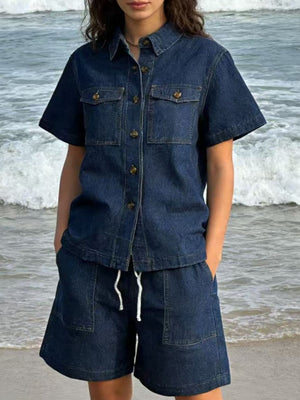 Button-up denim top and shorts set in dark blue with collared neckline and short sleeves.