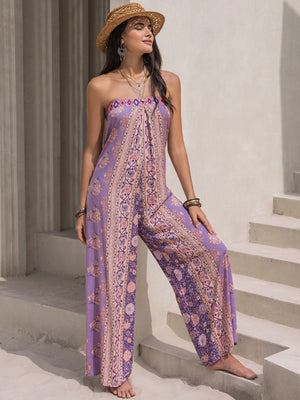 Lilac boho bandeau floral wide-leg jumpsuit with a patterned bodice and flowing pants.