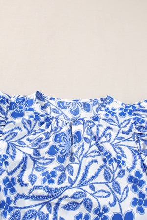 Blue floral print blouse with ruffled sleeves and keyhole neckline