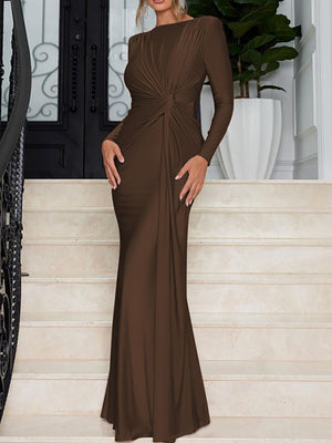 Brown ruched knot front maxi dress with long sleeves and a fitted silhouette.