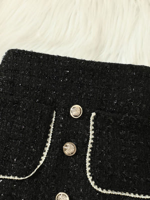 Black tweed skort with decorative buttons and trim