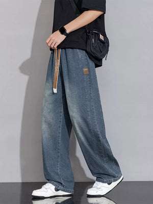 Relaxed vintage wash wide-leg jeans in Gray Blue with drawstring waist and patch detail.