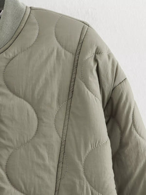 Moss green quilted button-down jacket with contrast stitching and ribbed collar detail.